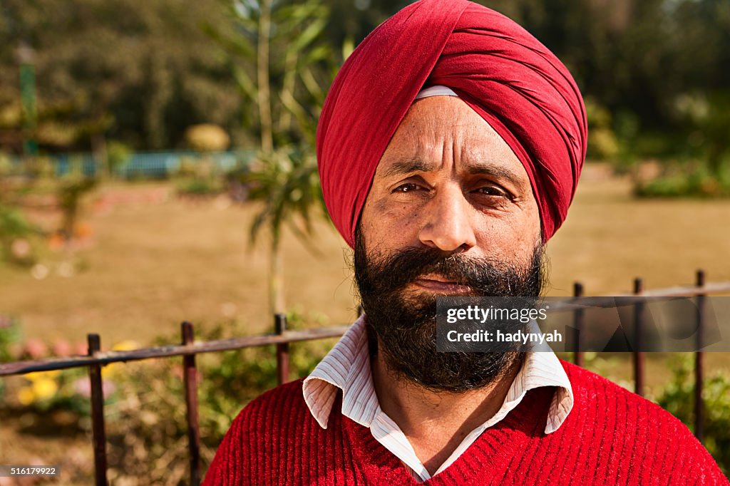 Portrait of Indian Sikh man near temple in Delhi