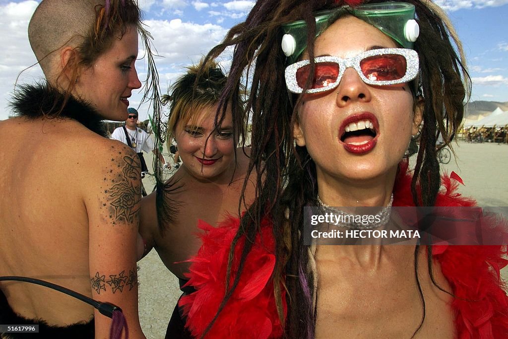 A group of women pose at Black Rock City's Burning