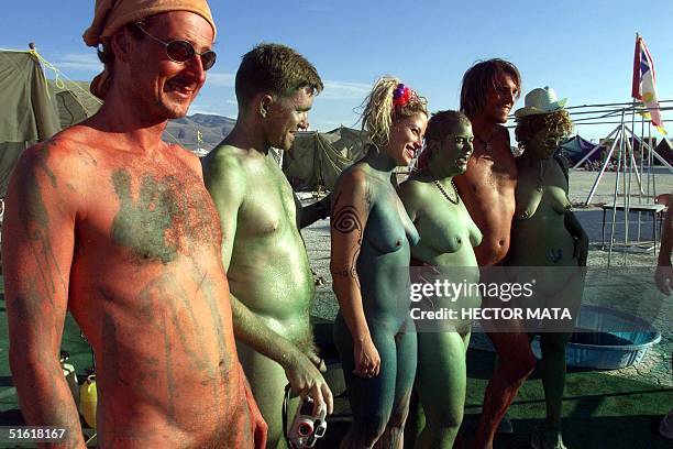 Group of body-painters pose during a performance at Black Rock City's Burning Man festival in Nevada 02 September 1999. Founded in 1986 by a group of...