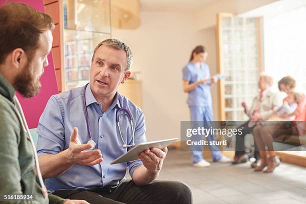 man to man healthcare - general practitioner with patient stock pictures, royalty-free photos & images