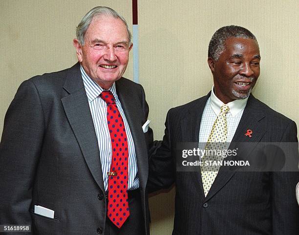 Financier David Rockefeller and South African President Thabo Mbeki pose after a breakfast meeting 22 September, 1999 at Rockefeller Center in New...