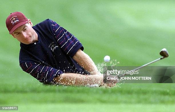 Ryder Cup team member Jim Furyk hits out of a sand trap 22 September 1999 during the second practice round at the Country Club in Brookline,...