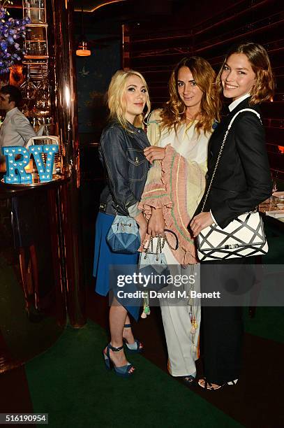 Camille Seydoux, Alexia Niedzielski and Arizona Muse attend a dinner hosted by Roger Vivier to celebrate the Prismick Denim collection by Camille...