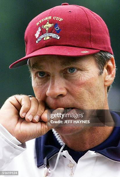 Ryder Cup team captain Ben Crenshaw bites his finger nail while watching team practice 22 September 1999 during the second practice round at the...