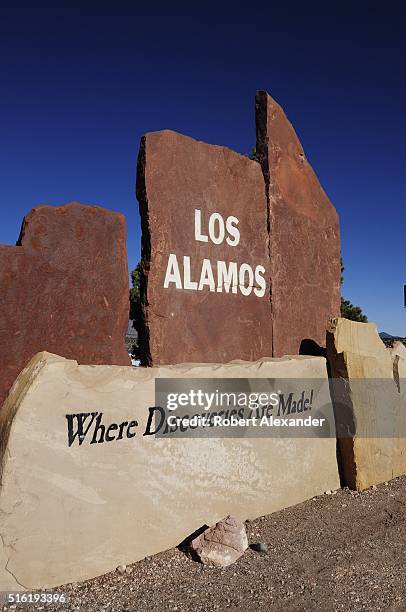 Stone sign welcomes motorists to Los Alamos, New Mexico, home to the Los Alamos National Laboratory established in 1943 as part of the Manhattan...