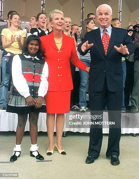 Republican Senator John McCain, with his wife Cindy and adopted daughter Bridget , announces his official bid for the 2000 White House race 27...