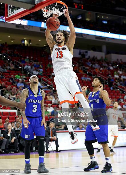 Anthony Gill of the Virginia Cavaliers dunks the ball in the second half against the Hampton Pirates in the first round of the 2016 NCAA Men's...