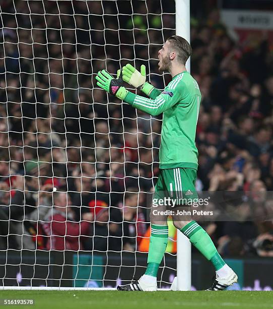 David de Gea of Manchester United celebrates Anthony Martial scoring their first goal during the UEFA Europa League Round of 16 Second Leg match...