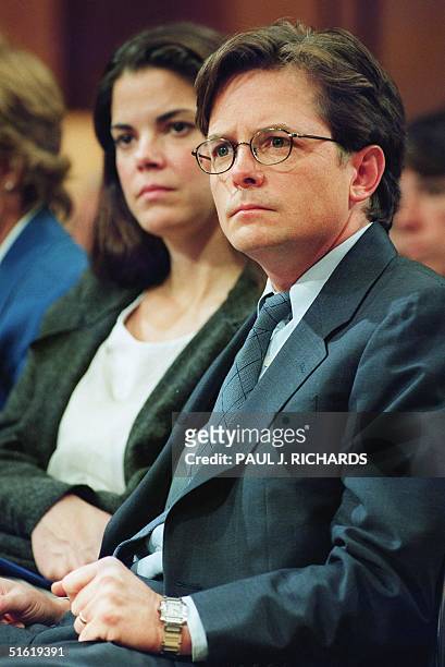 Actor Michael J. Fox , who suffers from Parkinson's Disease, waits to testify before a US Senate Appropriations subcommittee 28 September, 1999 on...