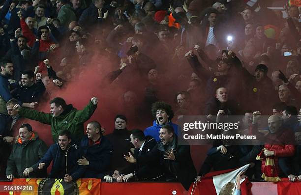 Liverpool fans celebrate Philippe Coutinho scoring their first goal during the UEFA Europa League Round of 16 Second Leg match between Manchester...