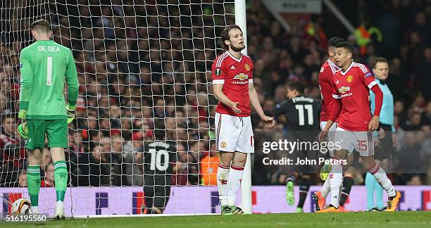 Daley Blind of Manchester United reacts to Philippe Coutinho of Liverpool scoring their first goal during the UEFA Europa League Round of 16 Second...