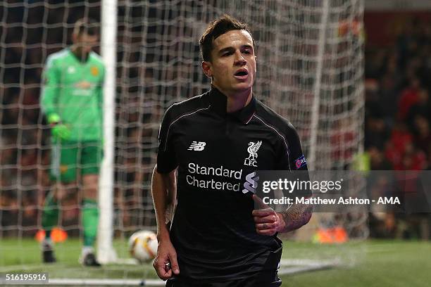 Philippe Coutinho of Liverpool celebrates scoring his team's first goal during the UEFA Europa League Round of 16 Second Leg match between Manchester...