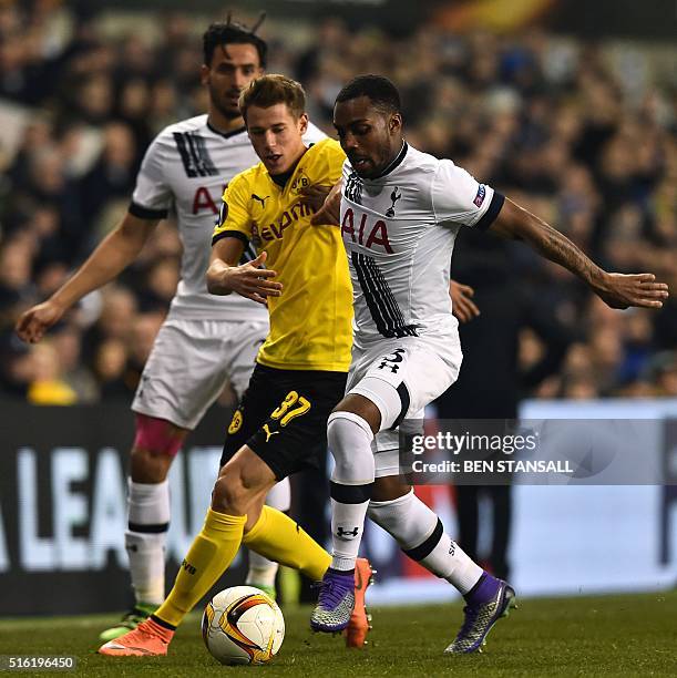 Borussia Dortmund's German defender Erik Durm vies with Tottenham Hotspur's English defender Danny Rose during the UEFA Europa League round of 16,...