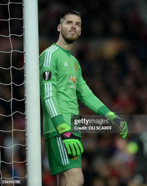 Manchester United's Spanish goalkeeper David de Gea reacts after conceding their first goal during the UEFA Europa League round of 16, second leg...