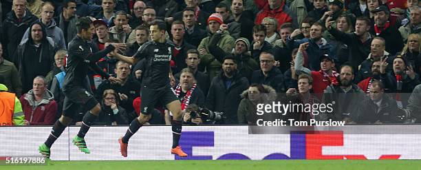 Philippe Coutinho of Liverpool celebrates scoring their first goal during the UEFA Europa League Round of 16 Second Leg match between Manchester...