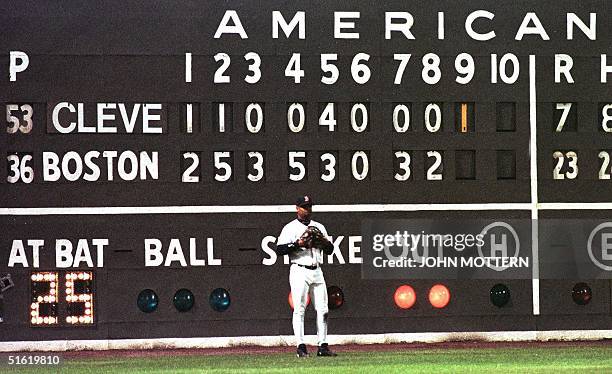 Troy O'Leary of the Boston Red Sox stands in front of the score board, which shows the final score of game four of the American League Division...