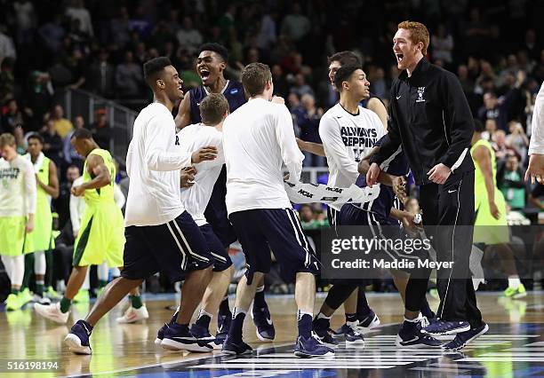 The Yale Bulldogs celebrate defeating the Baylor Bears 79-75 during the first round of the 2016 NCAA Men's Basketball Tournament at Dunkin' Donuts...