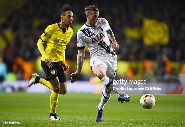 Toby Alderweireld of Tottenham Hotspur beats Pierre-Emerick Aubameyang of Borussia Dortmund to the ball during the UEFA Europa League round of 16,...