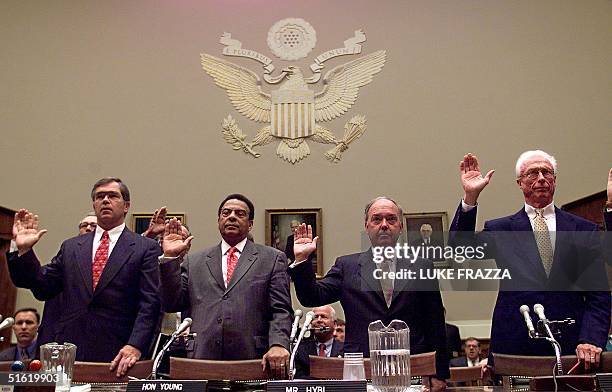 Billy Payne and Andrew Young of the Atlanta Olympic Committee and US Olympic Committee President Bill Hybl and former USOC President Robert Helmick...