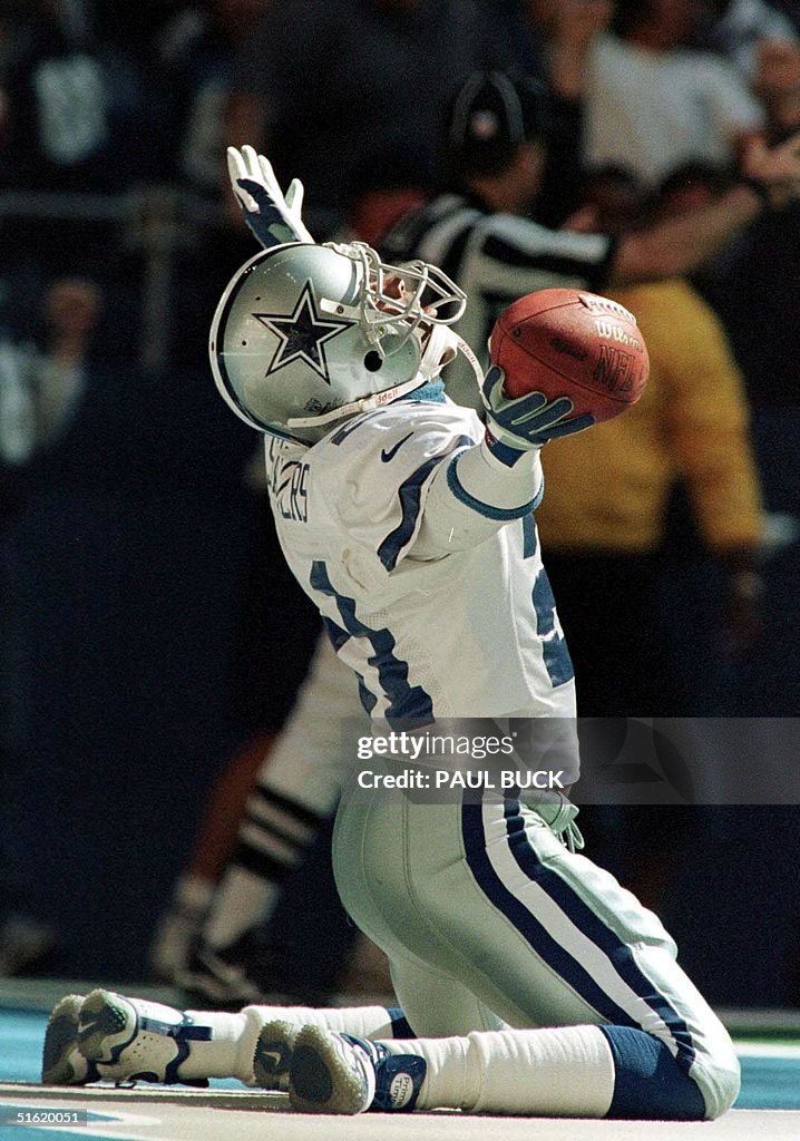 Deion Sanders of the Dallas Cowboys rejoices in th