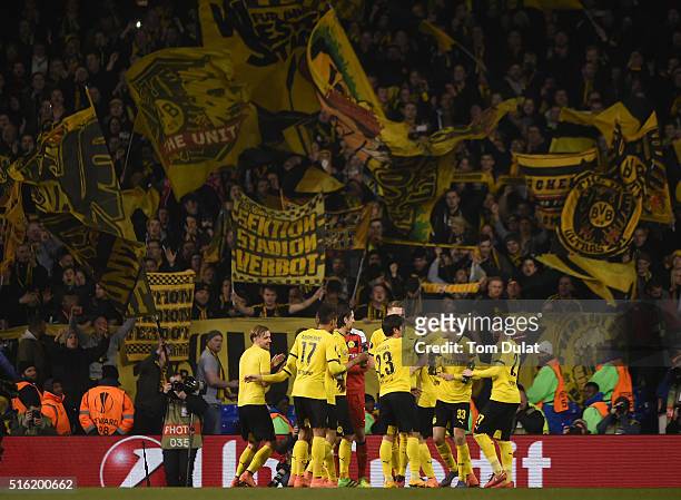 Borussia Dortmund celebrate victory with their fans after the UEFA Europa League round of 16, second leg match between Tottenham Hotspur and Borussia...