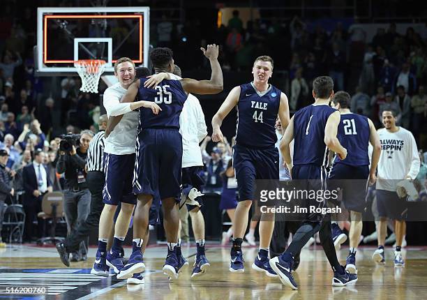 The Yale Bulldogs celebrate defeating the Baylor Bears 79-75 during the first round of the 2016 NCAA Men's Basketball Tournament at Dunkin' Donuts...