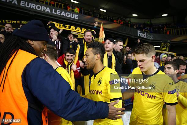 Pierre-Emerick Aubameyang of Borussia Dortmund and team mates celebrate victory with their fans after the UEFA Europa League round of 16, second leg...