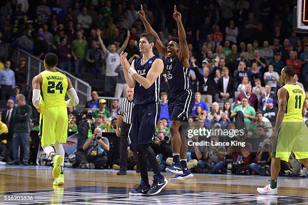 Anthony Dallier and Brandon Sherrod of the Yale Bulldogs celebrate following their 79-75 victory against the Baylor Bears during the first round of...
