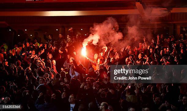 Liverpool fans set off flare during the UEFA Europa League Round of 16: Second Leg match between Manchester United and Liverpool at Old Trafford on...