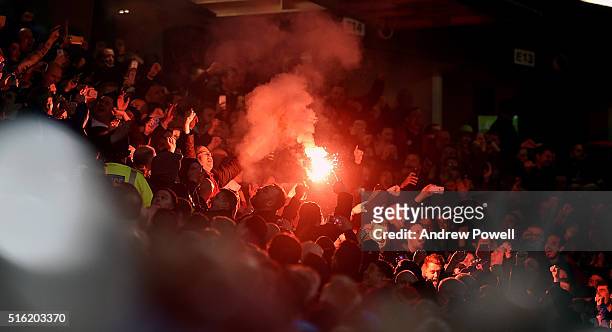 Liverpool fans set off flare during the UEFA Europa League Round of 16: Second Leg match between Manchester United and Liverpool at Old Trafford on...