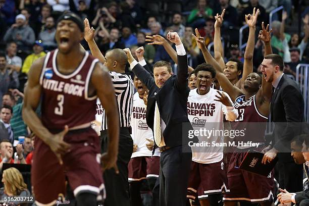 Members of the Arkansas Little Rock Trojans react after a score against the Purdue Boilermakers during the first round of the 2016 NCAA Men's...