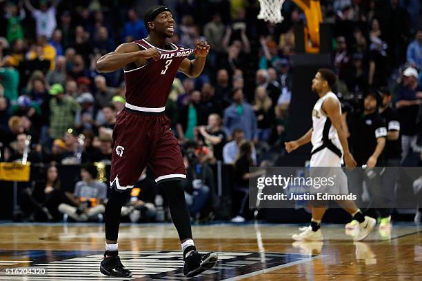 Josh Hagins of the Arkansas Little Rock Trojans reacts after the game against the Purdue Boilermakers goes into overtime during the first round of...