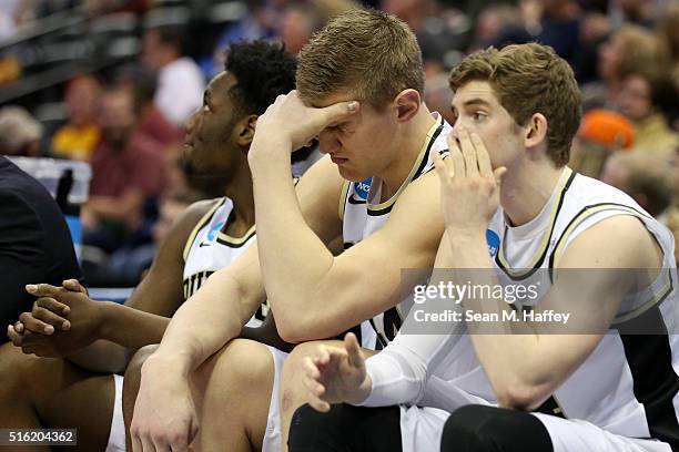 Members of the Purdue Boilermakers react at the end of regulation against the Arkansas Little Rock Trojans as the game goes into overtime during the...