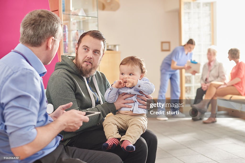 Father and son at the clinic