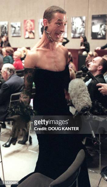 Herbert Karl of Munich, Germany shows off his Escada dress at the Marilyn Monroe auction at Christie's in New York 27 October 1999. Karl came from...