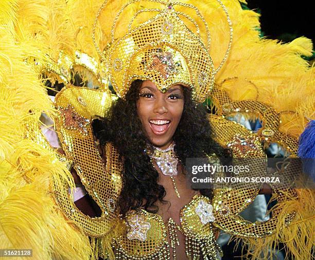 Brazilian samba dancer and godmother of the Caprichosos de Pilares samba school performs 16 February during the second night of samba school parade...