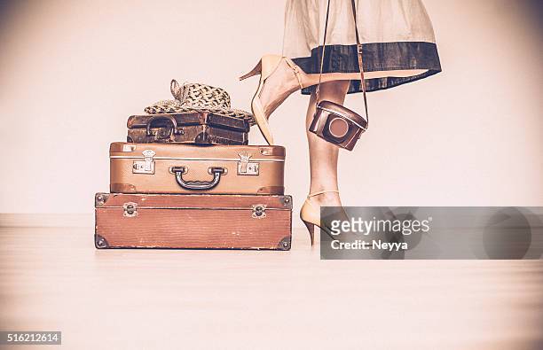 woman standing beside suitcases - beige dress stock pictures, royalty-free photos & images