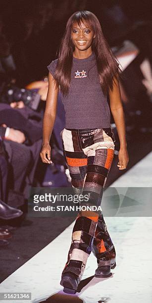 Model wears a t-shirt over patched leather pants during the Tommy Hilfiger fashion show 18 February in New York. The show is part of the Women's Fall...
