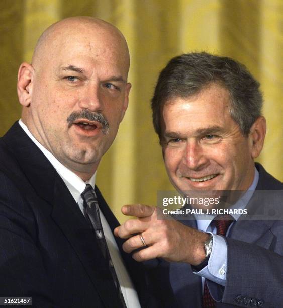 Former wrestler and current Governor of Minnesota, Jesse Ventura and son of former US President George Bush, George W. Bush speak at the start of the...