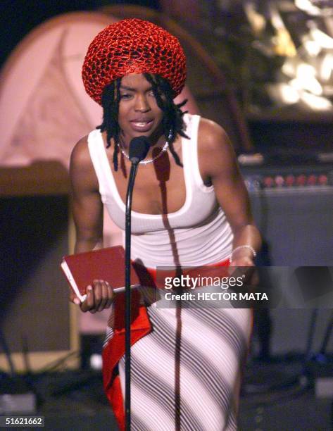 Singer Lauryn Hill delivers a speech as she receives her award for the Best New Artist at the 41st Grammy Awards at the Shrine Auditorium in Los...