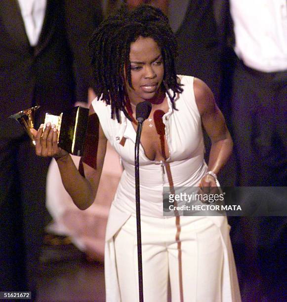 Singer Lauryn Hill receives her award for the Album of the Year at the 41st Grammy Awards at the Shrine Auditorium in Los Angeles 24 February. Hill,...
