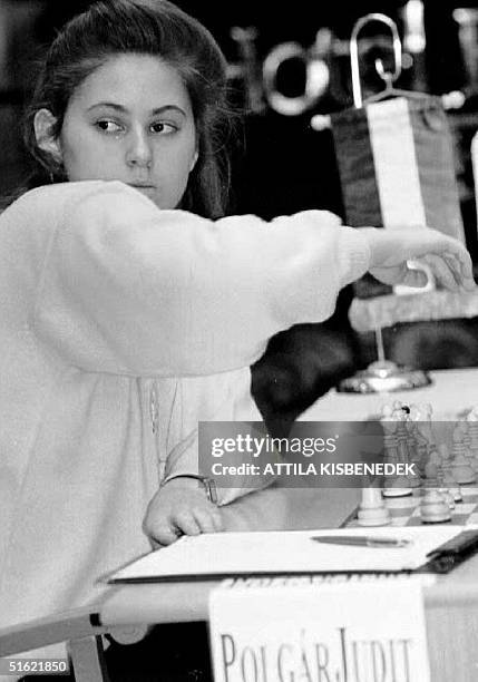 The youngest chess grand master, 17-year-old Hungarian Judit Polgar, looks over her shoulder at photographers before moving during the 10th and final...