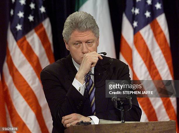President Bill Clinton pauses a moment while being asked about former White House intern Monica Lewinsky at a joint press conference with Italian...