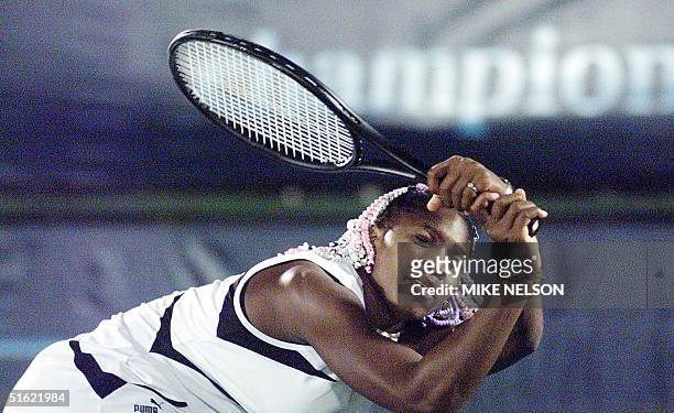 Tennis player Serena Williams follows through on a backhand against Jessica Steck of South Africa at the Evert Cup 05 March in Indian Wells,...