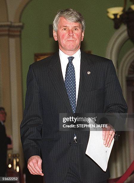 White House counsel Greg Craig approaches reporters outside the Senate chambers following a vote to depose witnesses for US President Bill Clinton's...