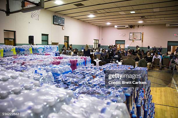 Flint CFO Jody Lundquist addresses residents' concerns regarding water bills at a town hall meeting held by Flint Mayor Karen Weaver about water,...