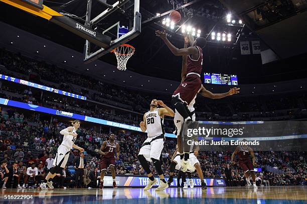 Josh Hagins of the Arkansas Little Rock Trojans makes a shot against the Purdue Boilermakers in double overtime during the first round of the 2016...