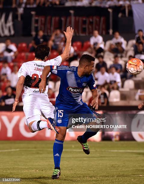 Pedro Quinonez of Ecuador's Emelec vies for the ball with Julian Benitez of Paraguay's Olimpia during their Libertadores 2016 Cup football match at...