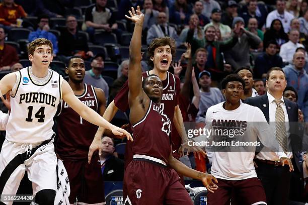 Kemy Osse of the Arkansas Little Rock Trojans reacts after making a three point shot over Ryan Cline of the Purdue Boilermakers in overtime during...