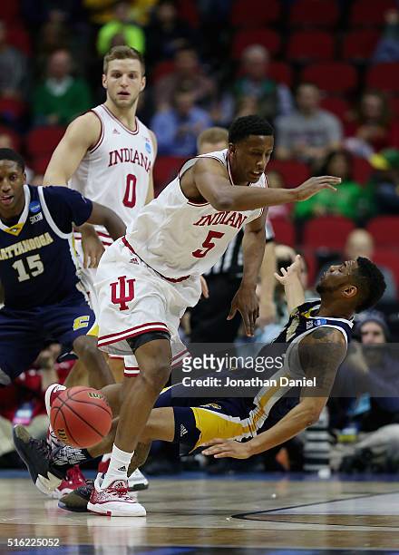 Troy Williams of the Indiana Hoosiers collides with Johnathan Burroughs-Cook of the Chattanooga Mocs in the first half during the first round of the...
